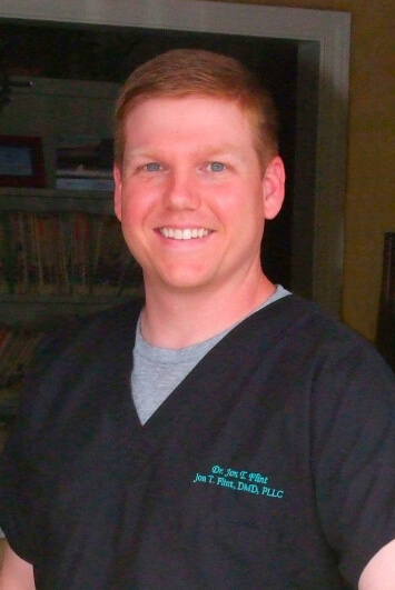 Headshot of Dr. Flint smiling